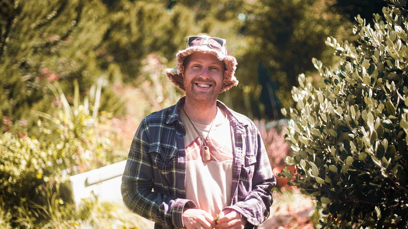 Izzy, owner of Aloha Gardening, passionate Wellington horticulturist specializing in organic garden maintenance and native plant landscaping